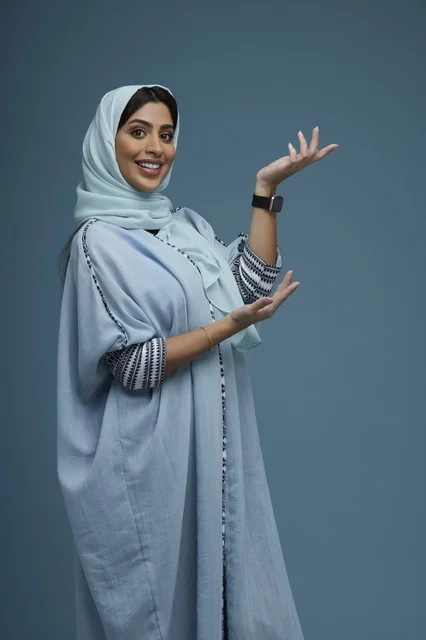 Saudi Woman in Abaya Presenting with Open Hands