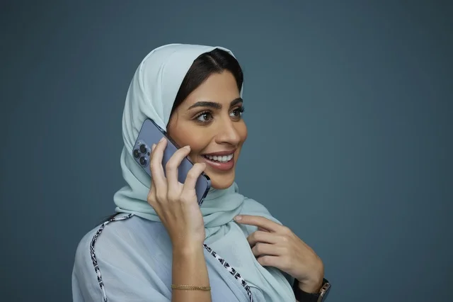 Saudi Woman in Hijab Talking on Smartphone Studio
