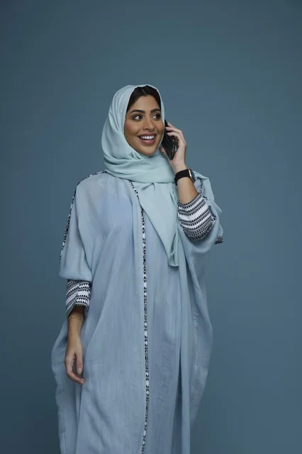 Saudi Woman in Hijab Talking on Smartphone