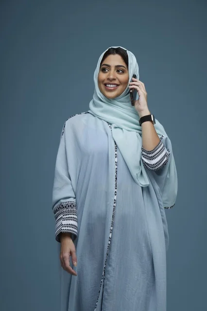 Saudi Woman in Hijab Talking on Smartphone Studio
