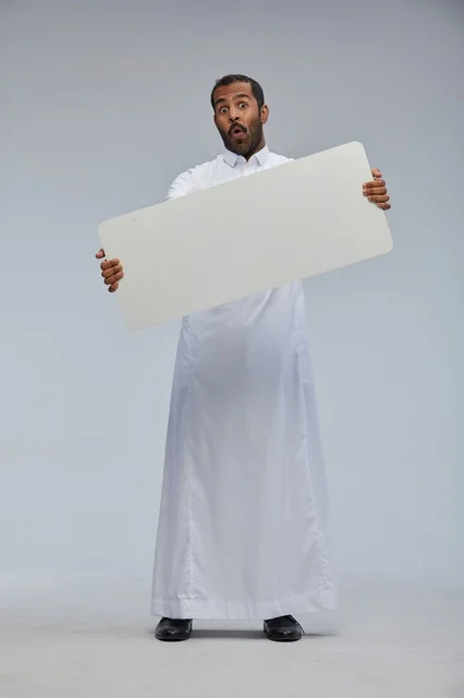 Surprised Saudi Man Holding Blank White Board Thobe