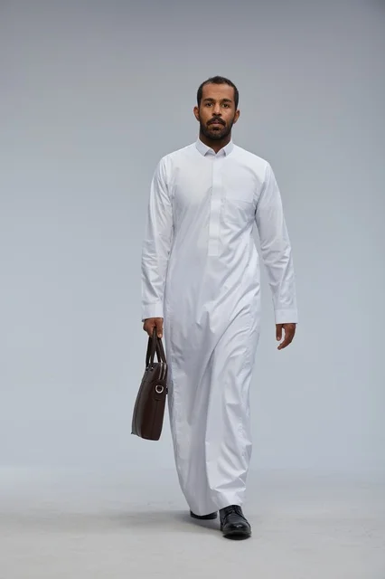 Saudi Businessman with Briefcase Walking in Studio