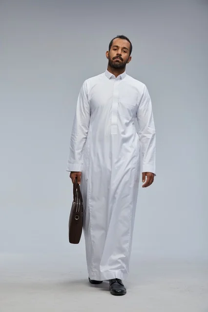 Saudi Businessman in Traditional Thobe with Briefcase