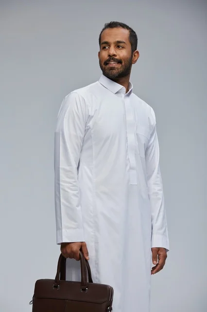 Saudi Businessman in White Thobe Holding Briefcase