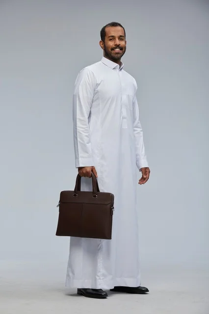 Saudi Businessman in Thobe Holding Briefcase in Studio