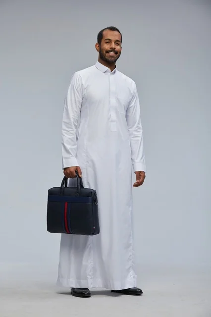 Saudi Businessman in Traditional Thobe Holding Briefcase