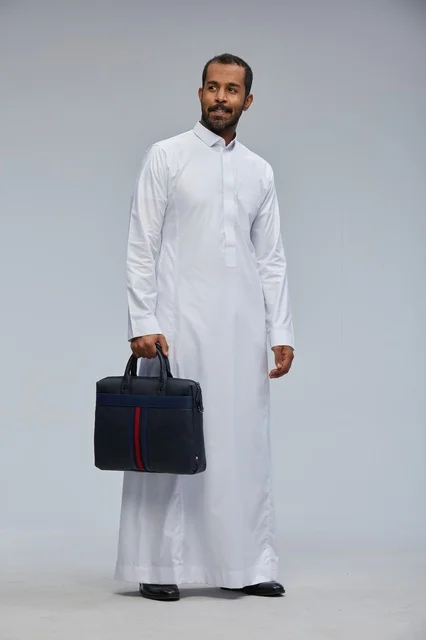 Saudi Businessman in Thobe Holding a Briefcase