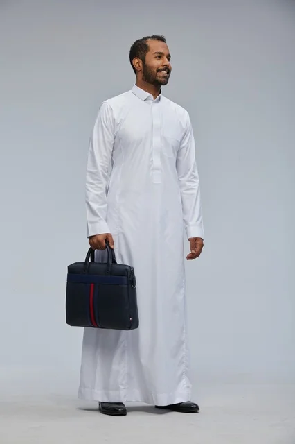 Saudi Businessman in Traditional Thobe Holding Briefcase