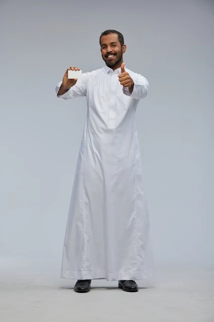 Saudi Man in Thobe Holding Blank Card with Thumbs Up