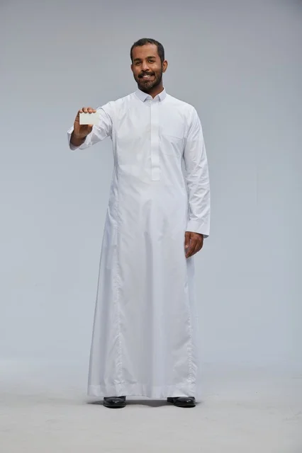 Saudi Man in Traditional Thobe Holding Blank White Card
