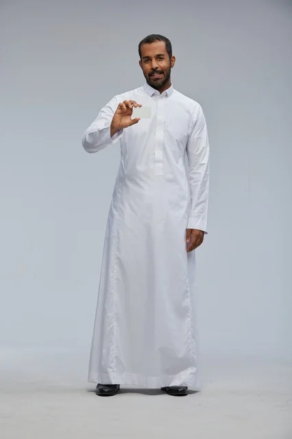 Saudi Man in Thobe Holding Blank Card Studio Full Length