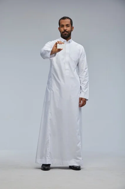 Saudi Man in Traditional Thobe Holding Blank Business Card