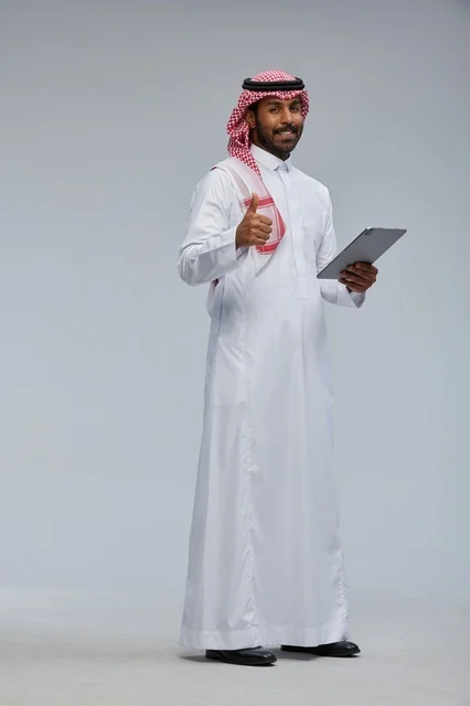 Saudi Man in Traditional Dress with Tablet Thumbs Up