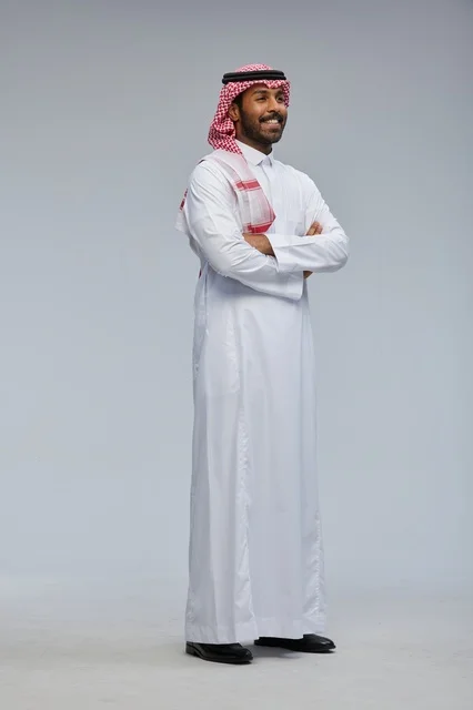 Saudi Man in Traditional Thobe with Crossed Arms