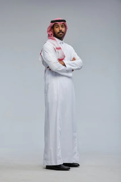 Saudi Man in Traditional Attire with Crossed Arms