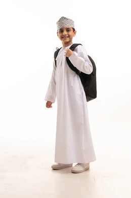 Omani Student Boy with Backpack in Traditional Dress