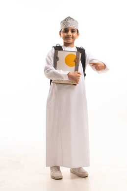 Omani School Boy in Traditional Dishdasha and Kuma