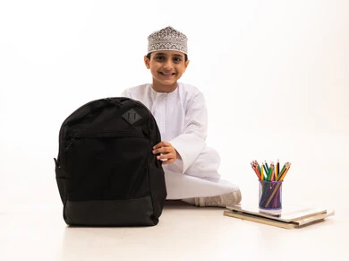 Omani Boy with School Backpack and Supplies