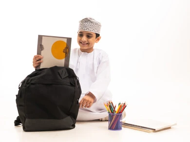 Omani Schoolboy with Backpack on White Background