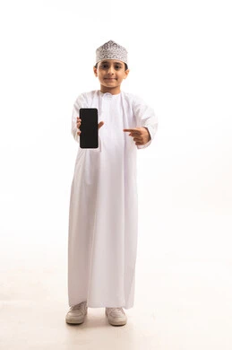 Omani Boy in Traditional Dress Pointing at Smartphone