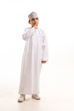 Thinking Omani Boy in Traditional Dishdasha and Kumma