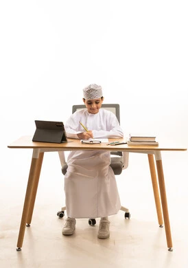 Omani Boy Studying with Tablet on White Background