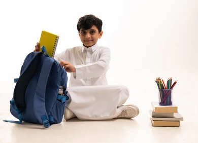 Saudi Boy with School Bag and Supplies