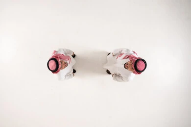 Saudi Men in Traditional Thobe and Shemagh Top Down View