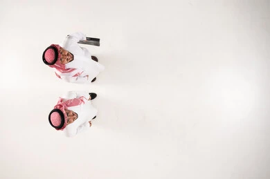 Saudi Businessmen in Traditional Dress Top-Down View