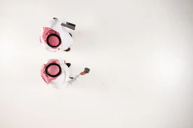 Top View of Two Saudi Businessmen on White Background