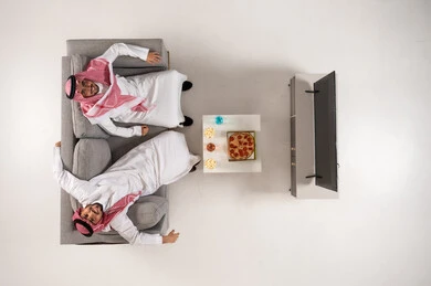 Saudi Men in Traditional Clothing with Pizza Top View