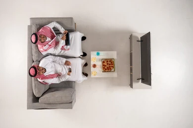 Saudi Men with Technology Top View in Living Room
