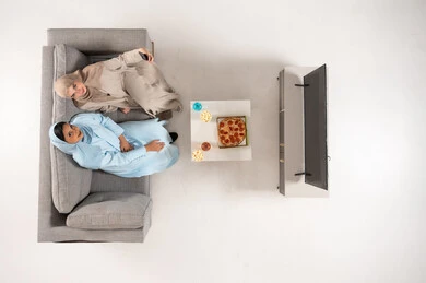 Saudi Women in Abayas Sitting on Sofa Overhead View