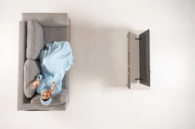 Arab Woman in Abaya on Sofa Top View