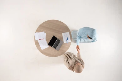 Arab Businesswomen Handshake Over Desk Top View