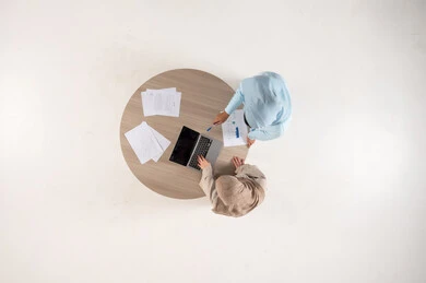 Arab Women Working on Laptop Overhead View