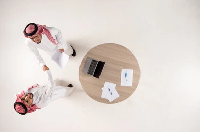 Saudi Businessmen Handshake Office Top View