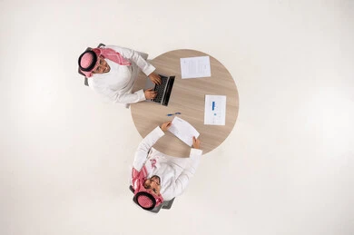 Saudi Businessmen at Office Table Top View
