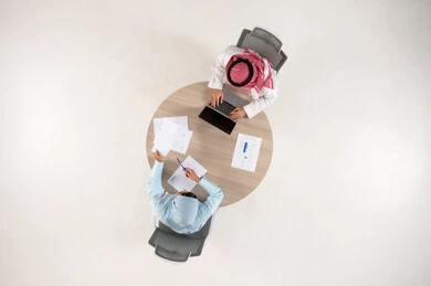 Top Down View of Saudi Business Meeting at Office