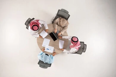 Saudi Professionals Meeting in Office Top Down View