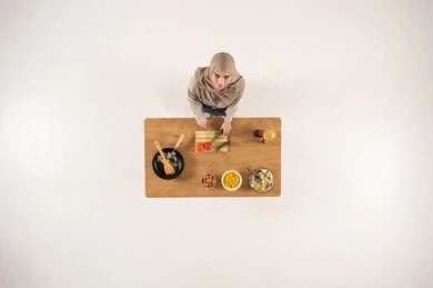 Arab Woman Cooking Healthy Meal Overhead View
