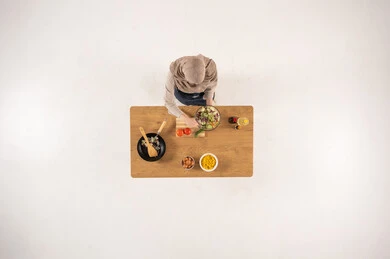 Arab Woman Cooking Salad Top View on White Background Arab Woman Cooking Salad Top View on White Background