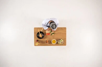 Omani Chef Cooking on Wooden Table Top Down View