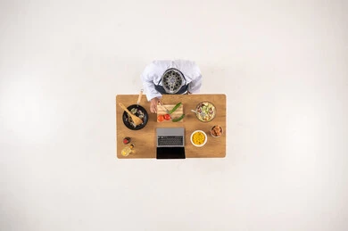 Saudi Man Cooking with Laptop Overhead View