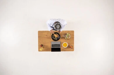 Saudi Chef Cooking with Laptop Top View