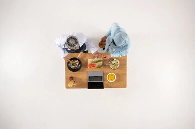 Omani Couple Cooking in Kitchen with Laptop Top View