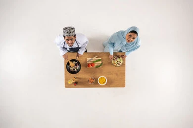 Omani Couple Cooking Together Top Down View