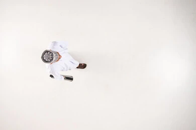 Omani Man in Traditional Dress Walking Top View White