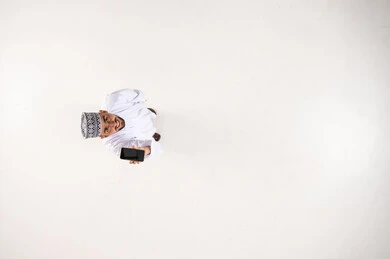 Omani Man with Smartphone High Angle Top View