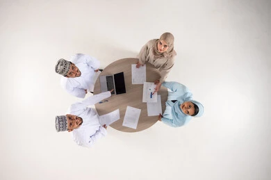 Omani Business Professionals Top-Down Office Meeting